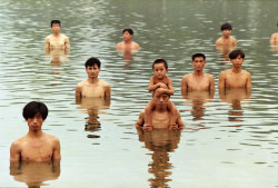 eqcuo:  Zhang Huan, “To Raise the Water Level in a Fishpond”, 1997, Beijing.  Documentation of a performance, in which the artist and 40 participants stood in a pond to raise the water level by a meter.