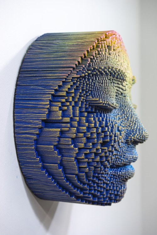 Face to FaceSculptor Gil Bruvel creates pixelated portraits from thousands of wood sticks. The anony