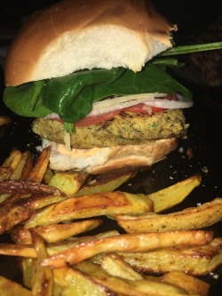 veganandcurvy:  Spicy black eyed pea burger dressed with spinach, tomato, onion, and chipotle mayo. Served with homemade fries!  Not vegan but looks good.