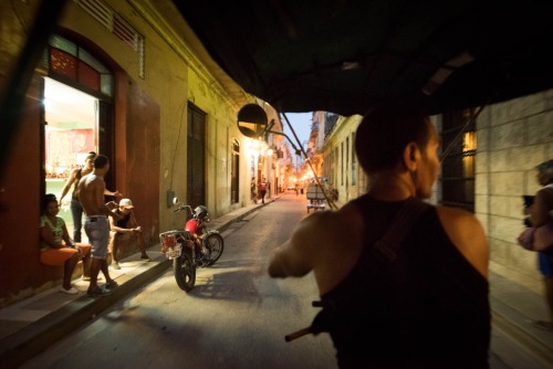 cubaypuertoricoson:A pedicab ride at dusk through the narrow streets of old Havana, Cuba. May 14th, 