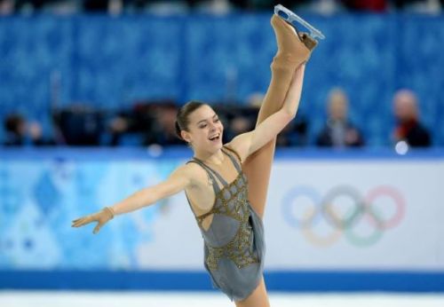 Adelina Sotnikova.Architectural gold blinging against a soft grey backdrop.One handed Beilmans. 