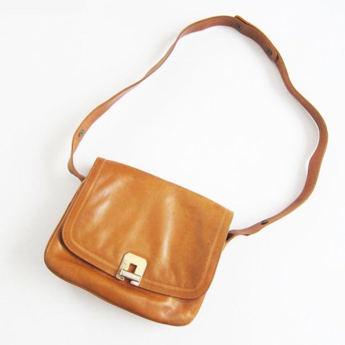 In the shop! Vintage 70s leather shoulder bag • love the brass turn lock on this one• www.milkteeths