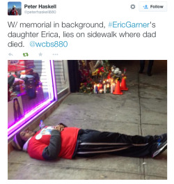 justice4mikebrown:  December 11: Eric Garner’s daughter, Erica, lies on sidewalk where her dad died. 