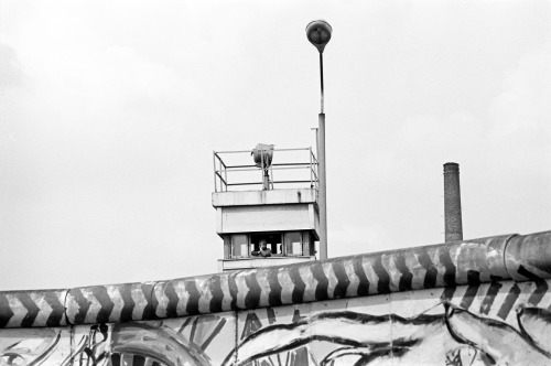 The Berlin Wall 1986. A bored Grepo gazes out from his guard tower on Waldemarstrasse. 