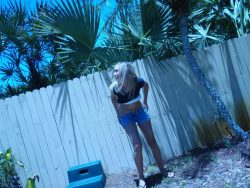 best-pee-blog:    Hot blonde squats down to piss in her yard.   