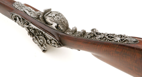 A heavily engraved and chiseled percussion muzzleloading rifle crafted by Giacomo Rinzi of Milan, ci