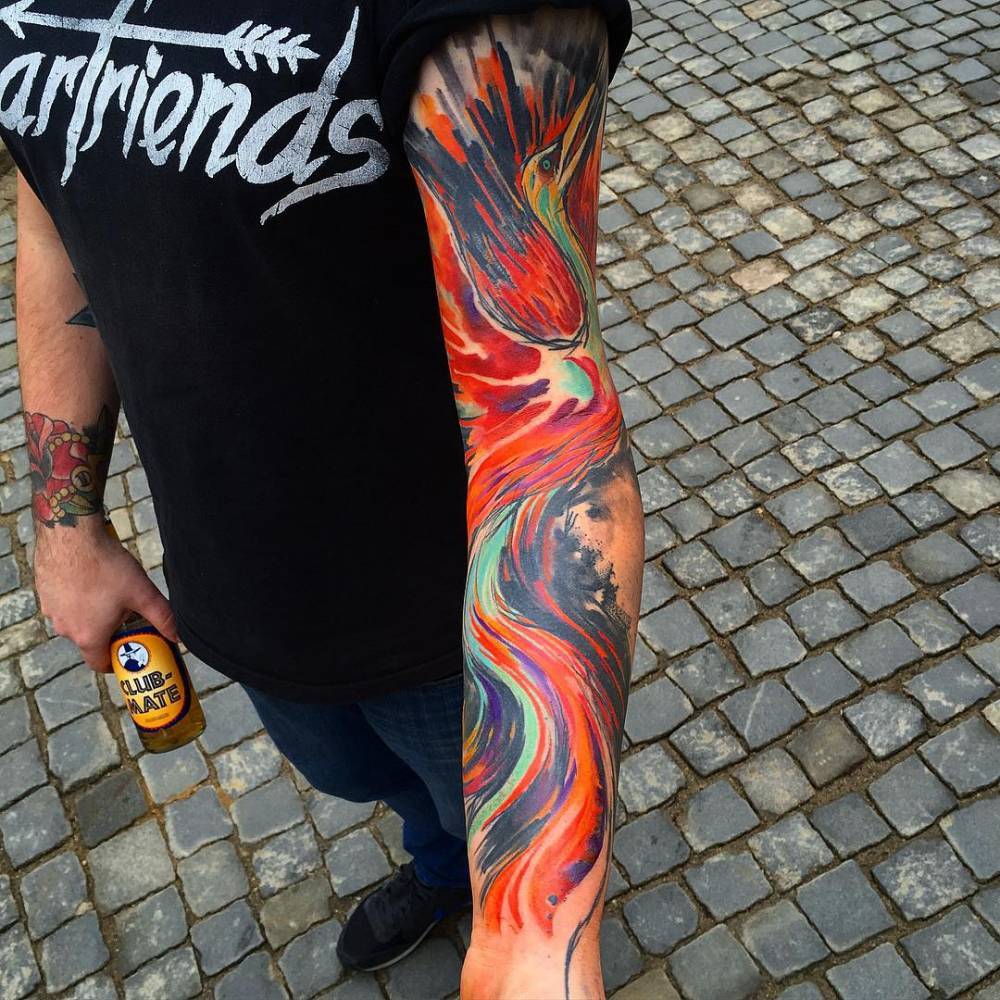 Abstract style sleeve tattoo that includes geometric