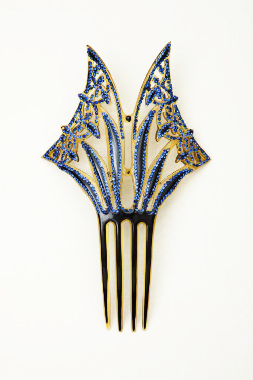 Combs, 1840-1909. Made of celluloid, one of tortoise shell. Via Goldstein Museum of Design.