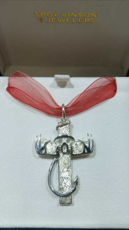 Custom designed and cast Outdoorsman’s cross with a family brand incorporated into the center 