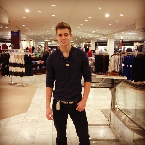 Posing for his Owner to make sure he looks good to in the wardrobe that was picked out for him.