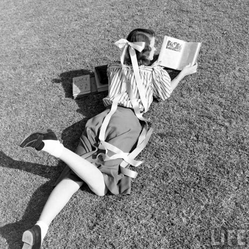 Can’t be seen reading without the ribbons(Cornell Capa. 1947)