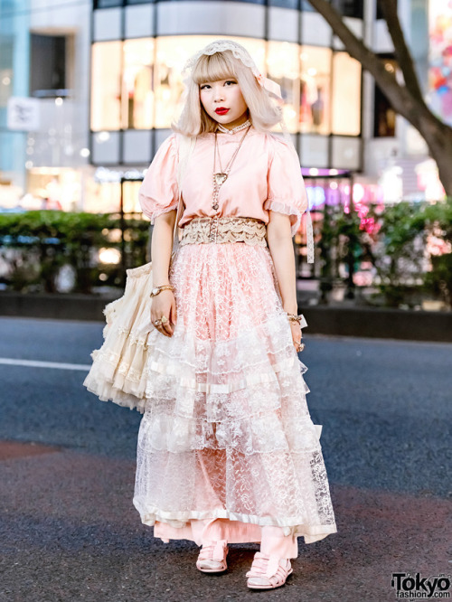 Young Japanese fashion designer Yukarin on the street in Harajuku wearing a headpiece by her own bra