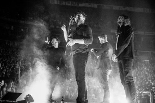 Mumford & Sons perform an acoustic set on the second stage at the back of the Bridgestone Arena 