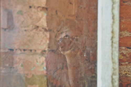 My reflection in a window at Tibetan in Jawalakhel, Kathmandu, Nepal. Wearing a kurta but you can&rs