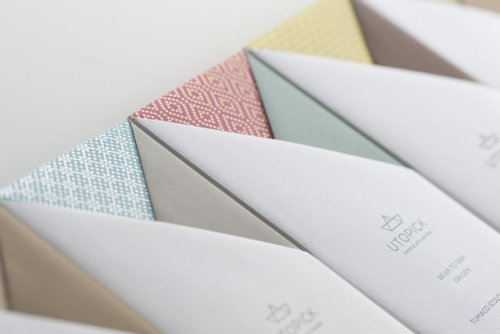Inspired by Spanish Explorers the origami paper logo resembles that of the sails of a ship, deigned 