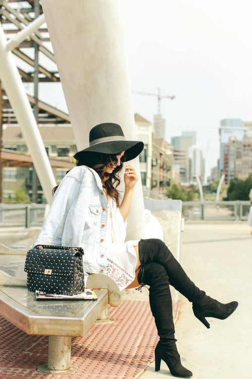 Desiré Falk in Stuart Weitzman boots