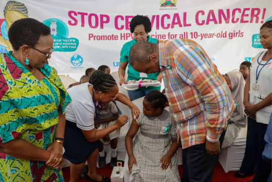 President Uhuru Kenyatta looks on as the human papillomavirus vaccine is administered to a 10-year-old girl during the launch of the HPV vaccine at Ziwani Primary School in Mombasa county.