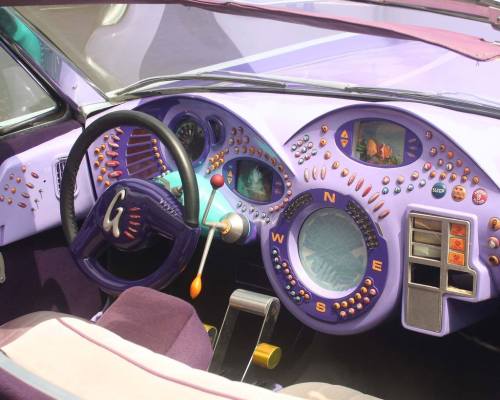 y2kaestheticinstitute:  Blobby dashboard design & excessive product placement of the ‘Gadgetmobile’ (Inspector Gadget - 1999)