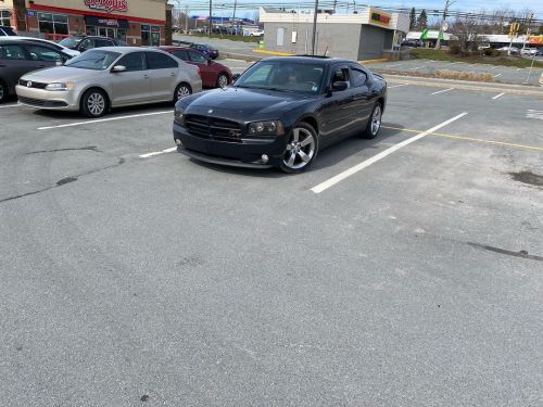 A bit dirty, but looking good in the parking lot #dodge #charger #hemi #rt #black #blue #sunny #warm