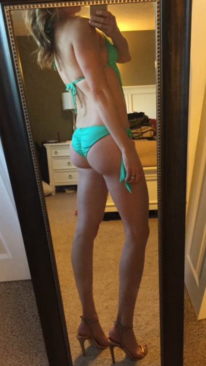 slavecumslutblueeyes:  She has many skimpy bikni’s…tanning for the neighbours to see