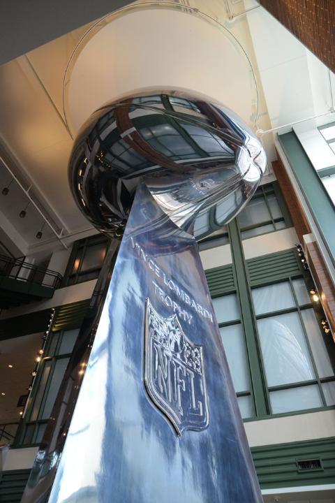 fyeahgreenbaypackers:  Packers unveil 50ft Lombardi Trophy at Lambeau Field.  Only the Green Bay Packers could display a 50-foot replica of the NFL's most revered trophy and not be guilty of hubris. You can do that sort of thing when the trophy is named