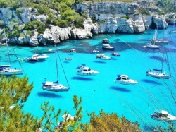 sixpenceee:In Menorca island, the crystal clear water makes the boats appear to fly. Via u/RadicalSuperfly