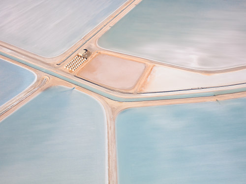 escapekit:  Australian Salt Germany-based photographer Kevin Krautgartner has captured the beauty of salt evaporation ponds, also called salterns. They are shallow artificial ponds designed to extract salts from sea water. To make it’s sea salt,