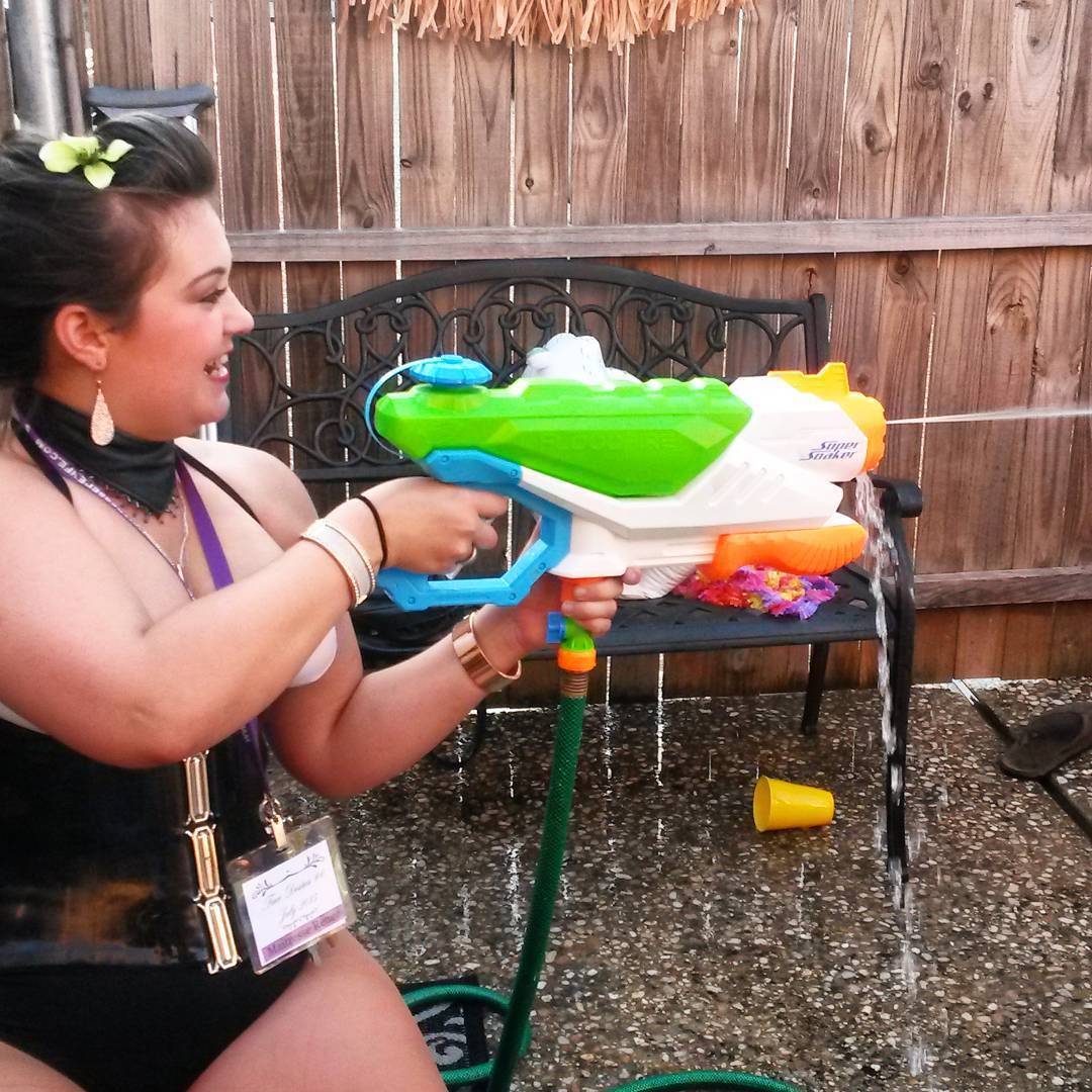 The subs are outgunned in the water fight. Time to hose them down! #femdom #mistress