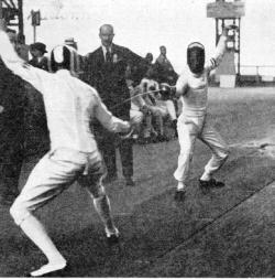 modernfencing: [ID: two foilists bouting,