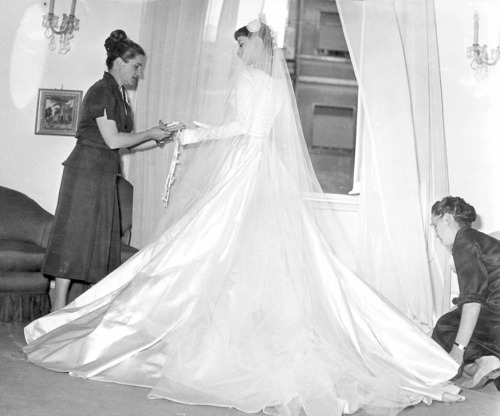 wehadfacesthen - Audrey Hepburn is fitted in her wedding dress...