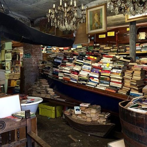 Alta Acqua bookshop in Venice. Boats filled with Italian books. by colemanm via http://ift.tt/1hU3EaA