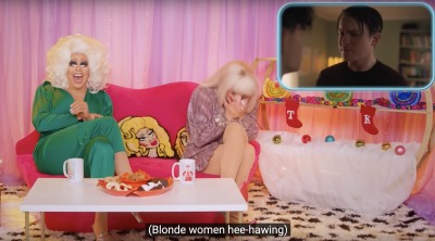 Drag queens Trixie and Katya sit on a pink couch on a colorful Christmas-themed Netflix set. Superimposed in the corner is a clip from Heartstopper. Caption reads: Blonde women hee-hawing