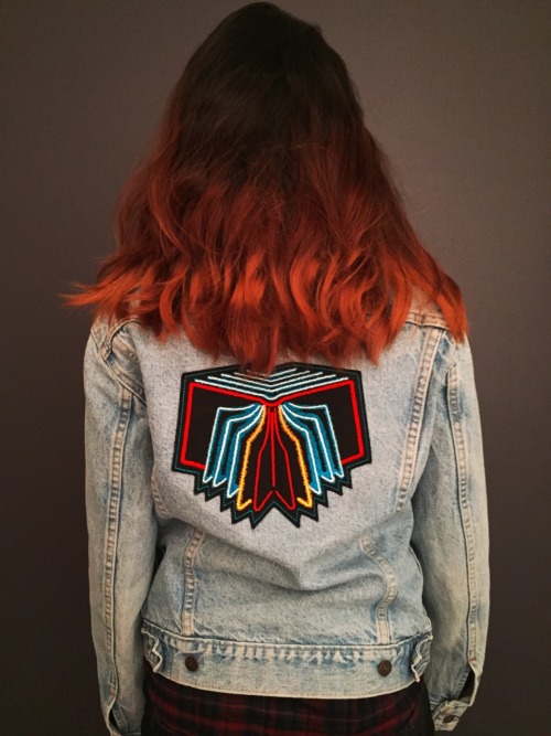 Varinia wearing the one-of-a-kind Neon Bible trucker jacket