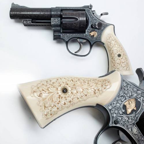 georgebeast:  Engraved Smith & Wesson This engraved Smith & Wesson Model 29 revolver must have been made up for a hog hunter who wanted a short, easily carried backup sidearm going after big pig in the brush. The golden inlays on either side of