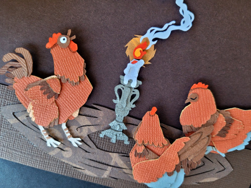 catadromously:curlicuecal:Halloween papercraft of this gorgeous artwork by @catadromously. I love the idea of chickens holding a seance and accidentally summoning their dinosaur ancestor.Have to confess, I got an hour into those little feather and bone
