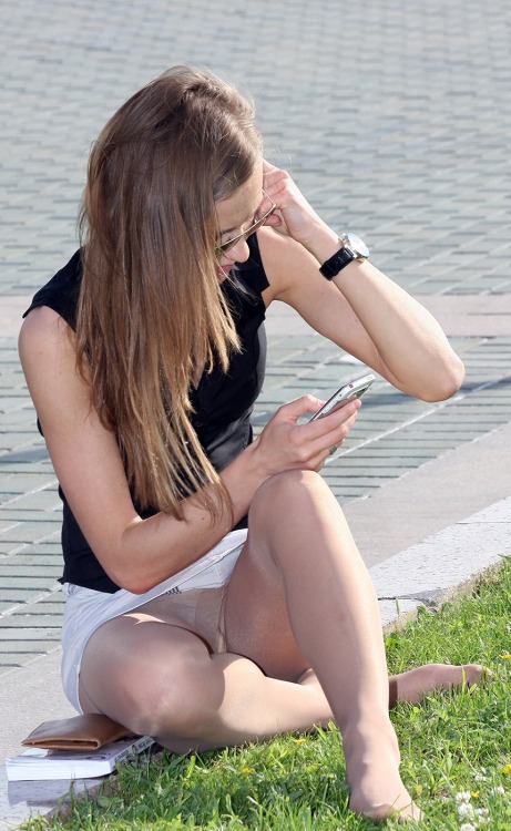 Nude pantyhose and nice view for this woman caught in the street.Woman in pantyhose