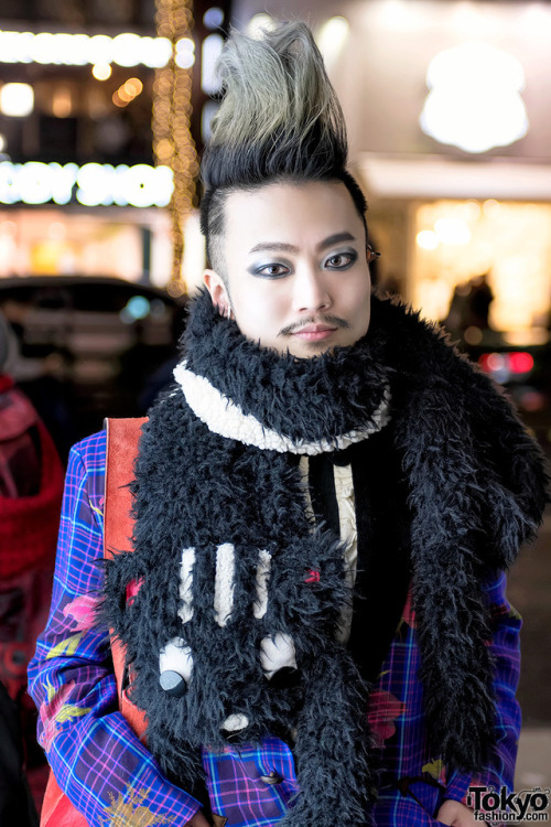 Japanese DJ and pianist Ohshi on the street in Harajuku wearing a plaid suit by MalkoMalka with a ca