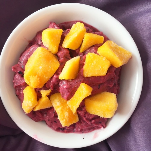 banana and mixed berry nicecream, topped with frozen mango! now that it’s getting warmer, cold