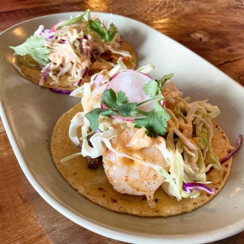 Surf and turf tacos (shrimp and steak), lamp chops with pomegranate glaze, gambas al ajillo.  San Fr