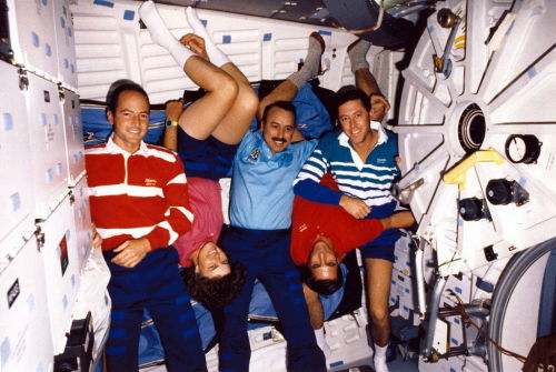 The crew of STS-43 on the middeck of Space Shuttle Atlantis