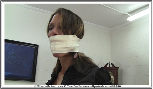 elizabethandrews:  @David_Andrews1 ballgags Stacey and then wraps microfoam tape around it before placing her into a hogtie on the desk. www.clips4sale.com/38880/9217205 - Stacey : Microfoam Ballgagged Boss’s Toy 