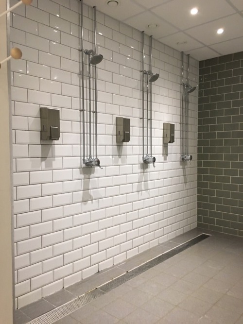 Showers in the changing room at The Hot Room in Leeds, the UK. The Hot Room is a Bikram yoga and pil