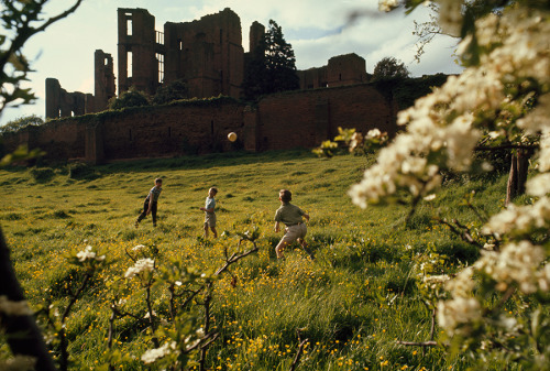 natgeofound:  Young boys throw a ball on a lush green hillside below castle ruins in Warwickshire, England, 1968.Photograph by Ted Spiegel, National Geographic