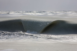 sixpenceee:  After months of deep freeze, one Massachusetts photographer captured some chilling beauty when ocean waves turned to slush. Jonathan Nimerfroh took a photo of what he called a “slurpee” wave hitting the Nantucket shoreline.