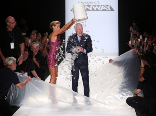 Heidi Klum assists Tim Gunn, as he does ALS Ice Bucket Challenge after Project Runway Fashion Show.