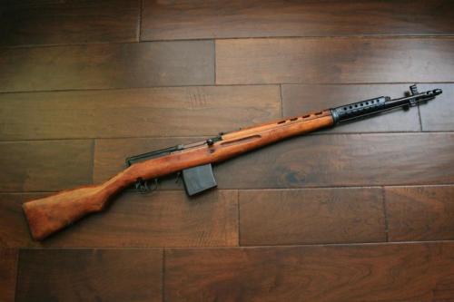 gunrunnerhell:  SVT-40 The failed attempt to replace the Mosin Nagant 91/30, the SVT-40 is chambered in the same 7.62x54R cartridge. You’ll note that both the left and right side of the stock have cutouts near the trigger area. This is an immediate