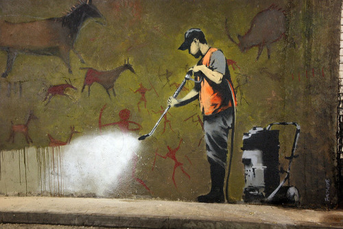 optates:  Banksy, a street artist whose identity remains unknown, known for his provocative stenciled pieces in the late 1990s.  