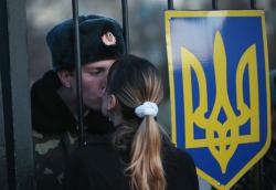 policymic:  Ukrainian soldier kisses his