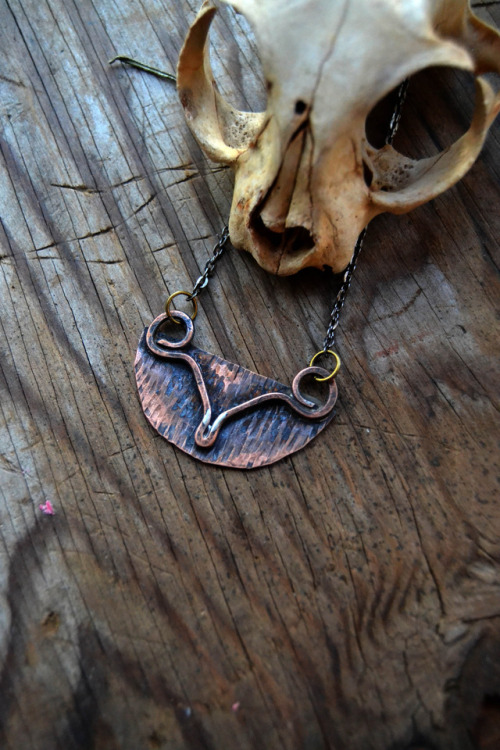 wolftea:still got some handmade copper pieces from my husband left up in the shop <3 100% hand cut, sanded, textured, stamped and given a rustic patina. The bottom photo is one of my favorites, reminds me of a symbol for fertility and femininity…