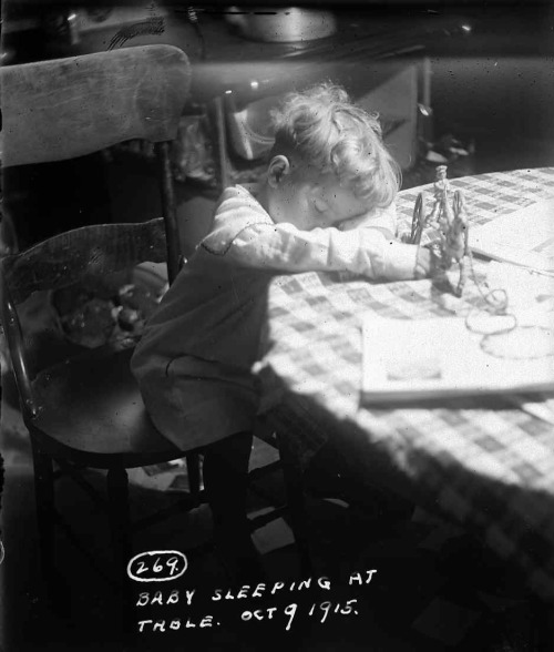 Baby sleeping at the table, 1915